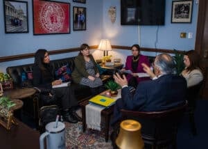 Celena Sarillo and others discussing legislative efforts with senator and staff