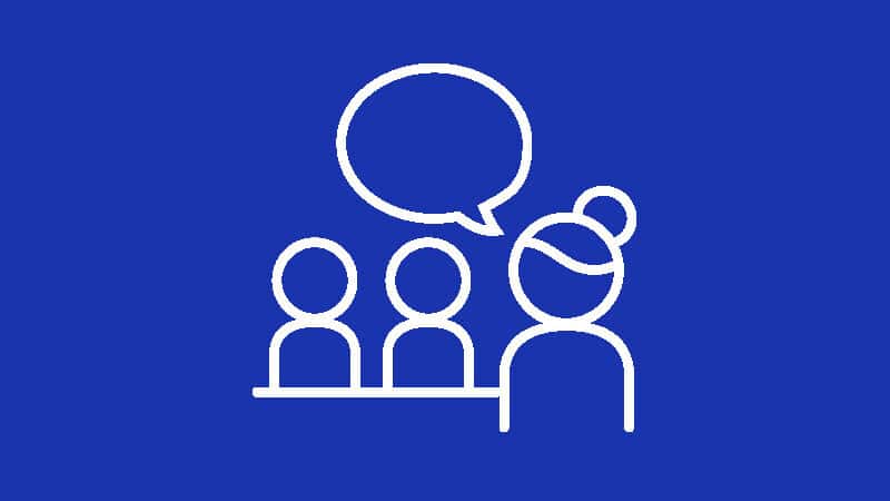 Vector graphic of a teacher speaking to two students_focus areas