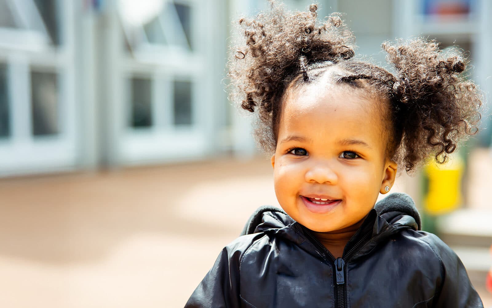 Educare Chicago student playing in outdoor playground